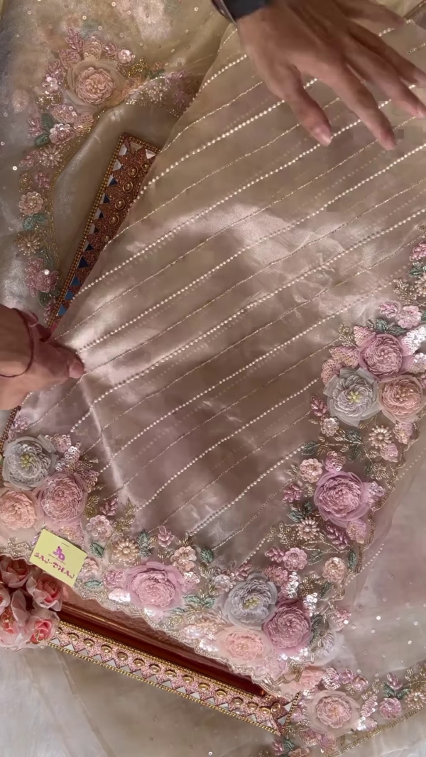 Elegant Embroidered Saree with Floral Motifs and Pearl Accents